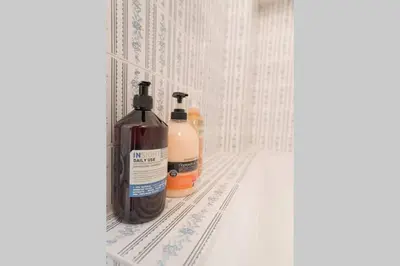 two bottles ofodorizers are sitting on a shelf at Spacious and Luxurious Apart Athens Center by MPS in Athens