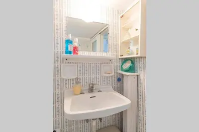 a bathroom with a sink and a mirror at Spacious and Luxurious Apart Athens Center by MPS in Athens