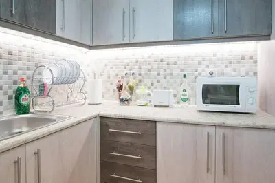 a kitchen with a sink and a microwave at Spacious and Luxurious Apart Athens Center by MPS in Athens