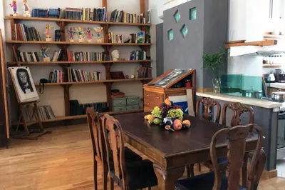 a dining room table with fruits and vegetables on it at Unique - Spacious Studio with rooftop / Thissio in Athens