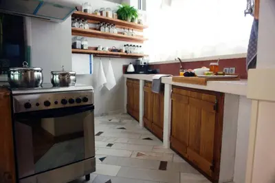 a kitchen with a stove and a counter top at Unique - Spacious Studio with rooftop / Thissio in Athens
