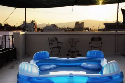 a set of blue inflatables on a roof at Unique - Spacious Studio with rooftop / Thissio in Athens