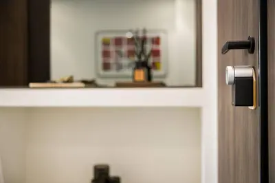a door with a mirror and a vase on a shelf at Luxury Apt near the Beach Athens Riviera by Olon in Athens
