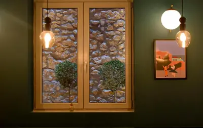 a window in a room with a stone wall at Metis Urbane Living Spaces in Athens