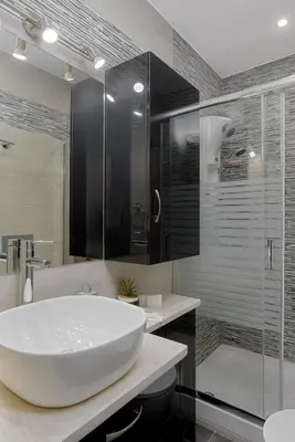 a bathroom with a large white tub and a shower at Acropolis Deluxe Apartment in Athens