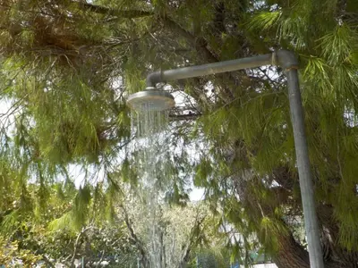 a street light with water in front of a tree at Casa Aqua Marina in Aghia Marina