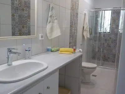 a bathroom with a sink and a toilet and a shower at Casa Aqua Marina in Aghia Marina