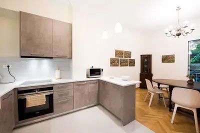 a kitchen with a table and a dining room at Klokkaris Stays Athens in Athens