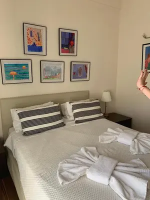 a bedroom with a bed with towels on it at Athenian cozy Apartment!!! By Gela in Athens