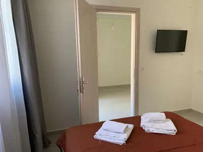 a room with a table with two white towels on it at Athenian cozy Apartment!!! By Gela in Athens