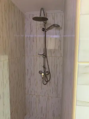 a shower with a shower head in a bathroom at Athenian cozy Apartment!!! By Gela in Athens