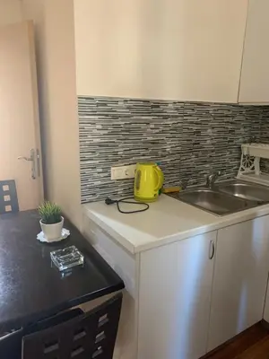 a kitchen with a sink and a yellow appliance on a counter at Athenian cozy Apartment!!! By Gela in Athens