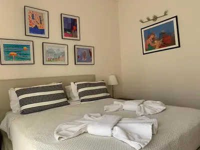 a bedroom with two beds with towels on them at Athenian cozy Apartment!!! By Gela in Athens