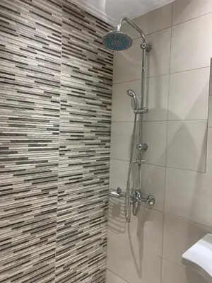 a shower with a glass door in a bathroom at Athenian cozy Apartment!!! By Gela in Athens