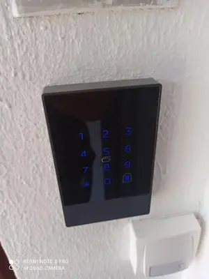 a remote control hanging on a wall at VARKIZA VIEW APARTMENT in Varkiza