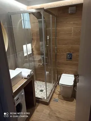 a bathroom with a shower and a toilet at VARKIZA VIEW APARTMENT in Varkiza