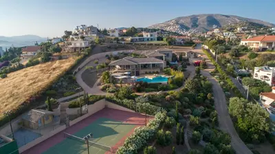 an aerial view of a house with a tennis court at LYCIPONON Villa in Anavissos