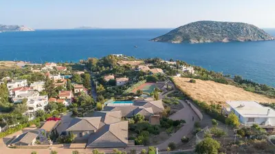 an aerial view of a house with the ocean at LYCIPONON Villa in Anavissos