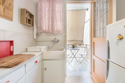 a small kitchen with a sink and a refrigerator at Private Rooms Athens - Shared Bathroom in Athens