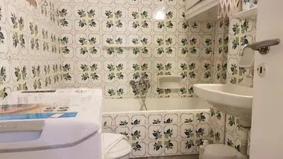 a bathroom with a tub and a toilet and a sink at Teal Apartment - Athens Center, 4 BD, 2 BATH in Athens