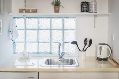 a kitchen with a sink and a window at Blue Couple House Athens in Athens