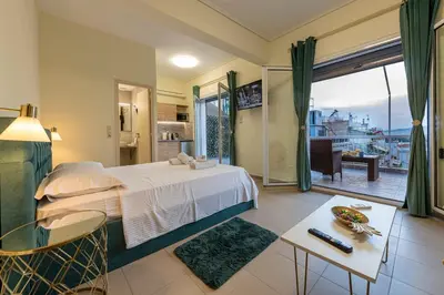 a hotel room with a bed and a balcony at Athens Plaka House in Athens