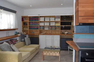 a living room with a couch and a table at h2h Myrto #Λειτουργικό studio 30' Αθήνα, 15' Αεροδρομιο in Athens