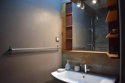 a bathroom with a sink and a mirror at h2h Myrto #Λειτουργικό studio 30' Αθήνα, 15' Αεροδρομιο in Athens