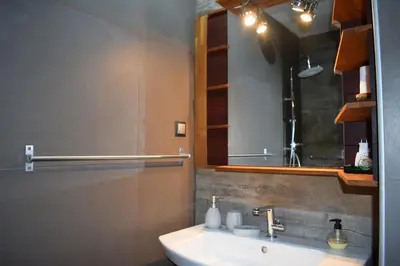 a bathroom with a sink and a mirror at h2h Myrto #Λειτουργικό studio 30' Αθήνα, 15' Αεροδρομιο in Athens