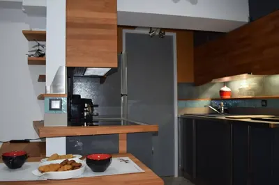 a kitchen with a plate of food on a table at h2h Myrto #Λειτουργικό studio 30' Αθήνα, 15' Αεροδρομιο in Athens