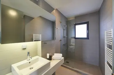 a bathroom with a sink and a shower at Ma Maison No4,Downtown Loft,360Mbps,Acropolis walk in Athens