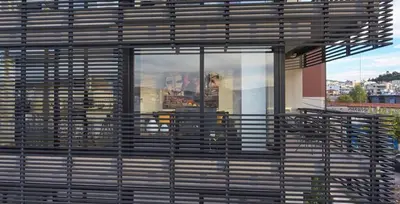 a building with a lot of windows and benches at Ma Maison No4,Downtown Loft,360Mbps,Acropolis walk in Athens
