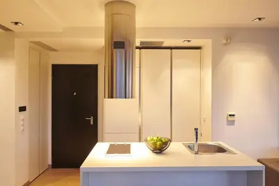 a kitchen with a sink and a bowl of fruit on a counter at Ma Maison No4,Downtown Loft,360Mbps,Acropolis walk in Athens