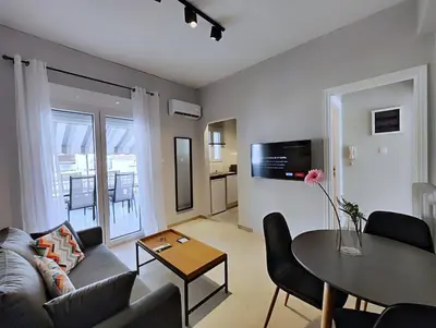a living room with a couch and a table at Zea Apartments in Piraeus
