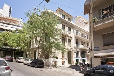 a street with cars parked on the side of a building at Charitos IΧ, Chic n modern 2BD Apt in Athens