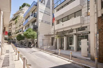 an empty street in front of a building at Charitos IΧ, Chic n modern 2BD Apt in Athens