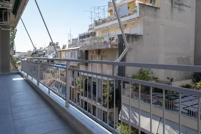 a balcony of a building with plants on it at Urban Boho apartment in Koukaki in Athens