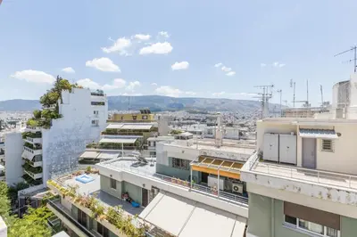 an aerial view of a city with buildings at Filoxenia MG Kolonaki Athens in Athens