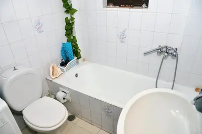 a bathroom with a tub and a toilet and a sink at TRADITIONAL HOUSE in Athens