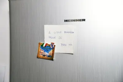 a refrigerator with a piece of paper on it at TRADITIONAL HOUSE in Athens