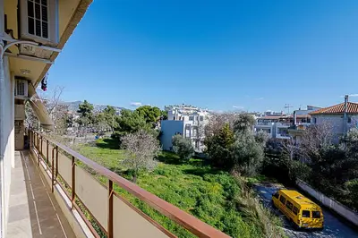 a yellow van is parked on a balcony at Two Bedroom Apartment in Chalandri with Balcony in Athens