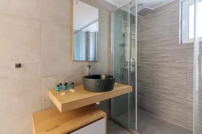 a bathroom with a sink and a shower at Two Bedroom Apartment in Chalandri with Balcony in Athens