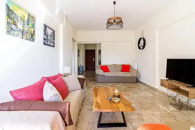 a living room with a couch and a table at Two Bedroom Apartment in Chalandri with Balcony in Athens