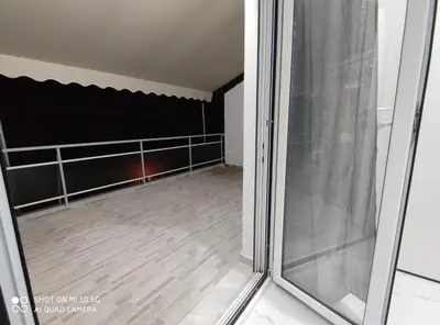 an empty room with a sliding glass door at Modern apartment with a huge terrace in Athens