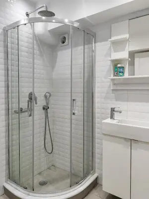 a bathroom with a shower and a sink at KYMA Apartments Athens 18 in Athens
