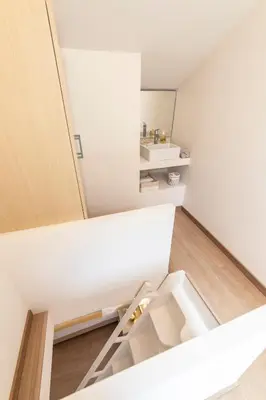 a small bathroom with white walls and a sink at Gallery Suites & Residences Piraeus in Piraeus