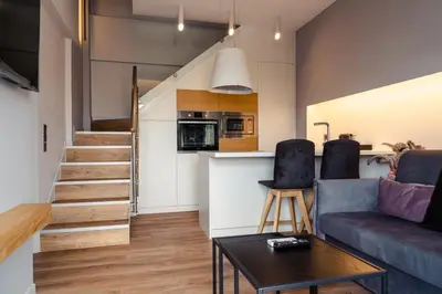 a living room with a couch and a table at LUX&EASY Athens Downtown Apartments in Athens