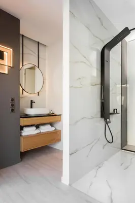 a bathroom with a sink and a mirror at LUX&EASY Athens Downtown Apartments in Athens