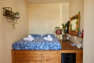 a bedroom with a bed with two pillows on it at Mosaics Athens Penthouse with Acropolis view in Athens