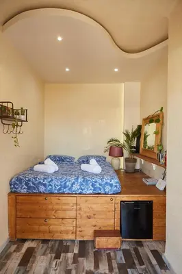 a bedroom with a bed with two towels on it at Mosaics Athens Penthouse with Acropolis view in Athens
